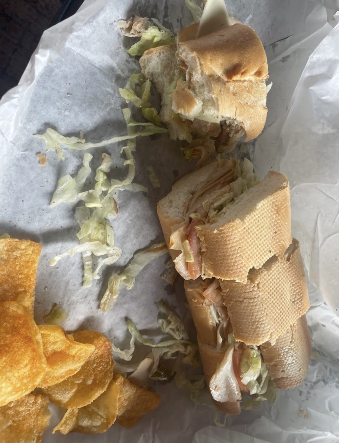 Sub sandwich served with chips